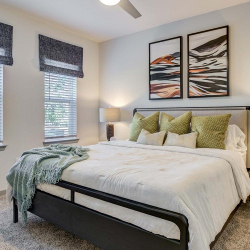 Relax and recharge in beautiful and spacious bedrooms a bedroom with a bed and a desk